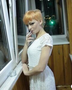 Hottie sits by the window in an outfit