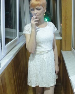 Hottie sits by the window in an outfit