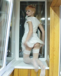 Hottie sits by the window in an outfit