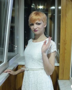 Hottie sits by the window in an outfit