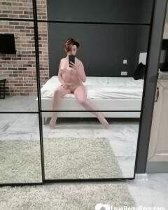 Babe with short hair tries on some stockings