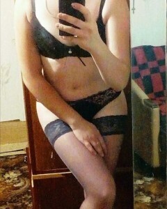 Babe with short hair tries on some stockings