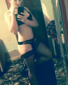 Babe with short hair tries on some stockings